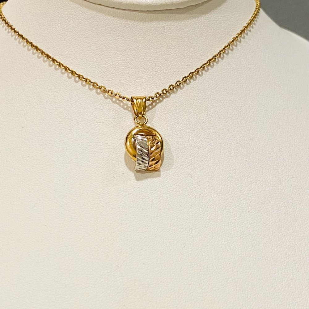 Two Tone Pendant 18k interwoven bands of yellow, white, and rose gold.